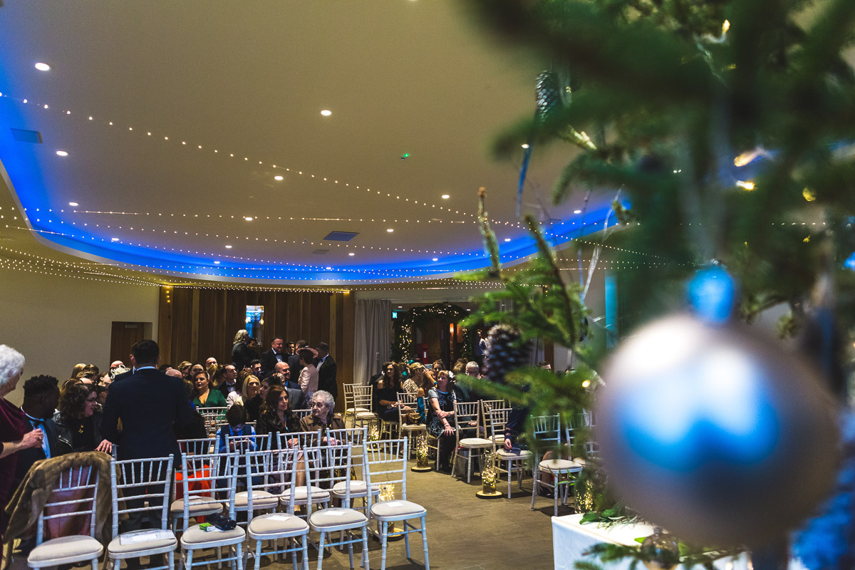 Guests arriving at a festive decorated winter wedding at The Out Barn in Clough Bottom