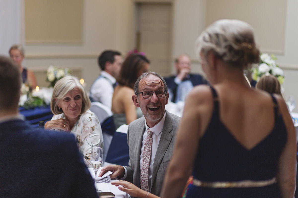 Guests laughing during a wedding reception