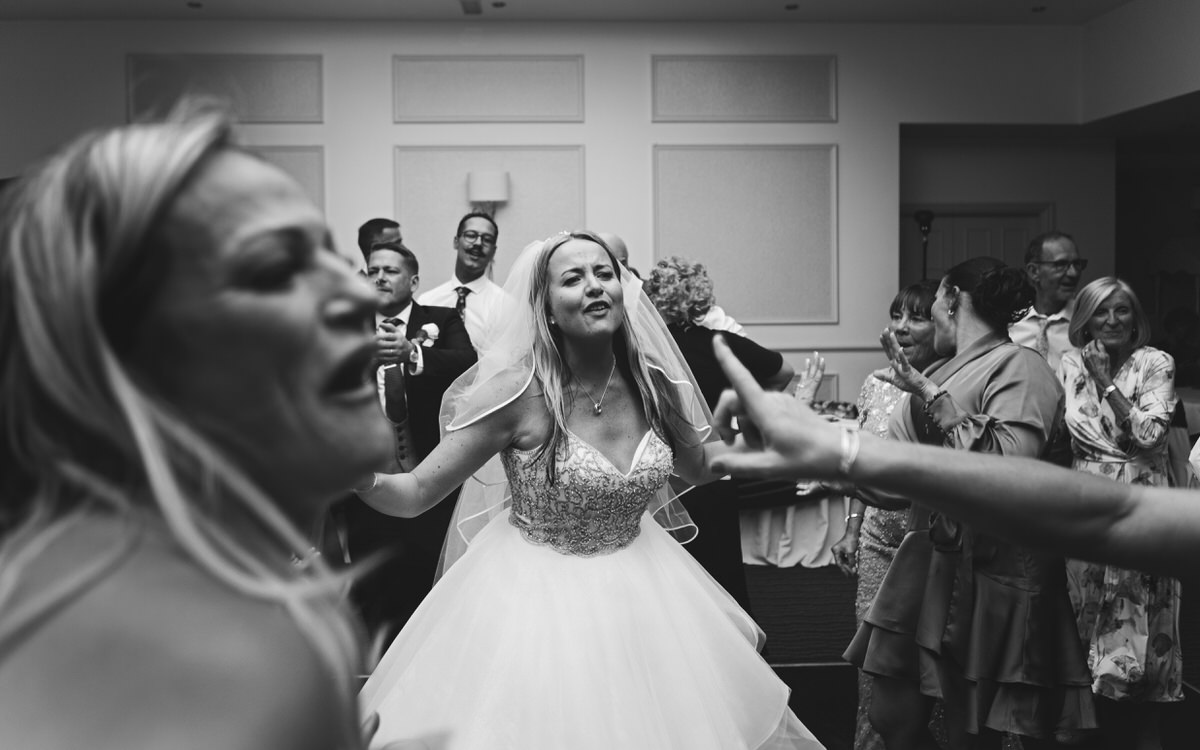 A bride dances on the dance floor at her wedding