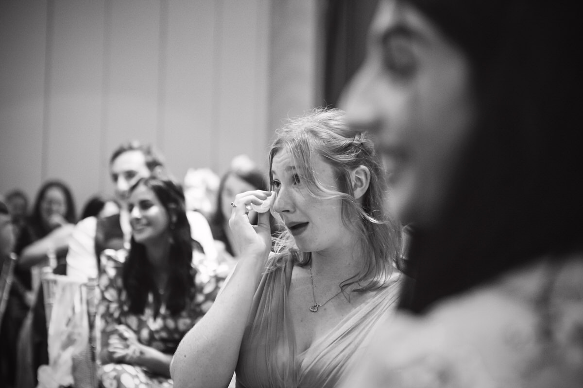 A wedding guest sheds a tear during the speeches
